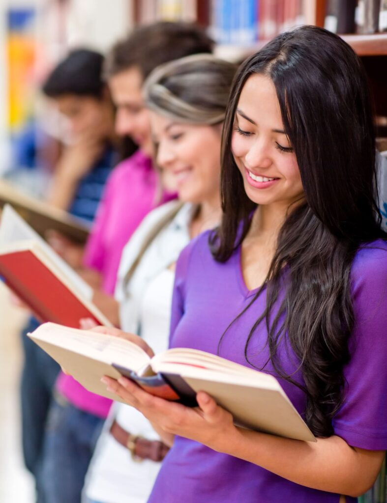 group of students investigating at the library